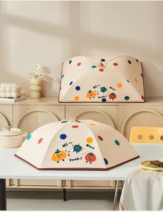 Scene showing two styles of foldable thermal food covers with cute cartoon vegetable patterns.