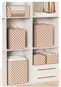 Detail view of checkered drawstring storage bins organized in a minimalist white wardrobe unit