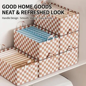 Checkered fabric storage bins with handles for organizing clothes in wardrobe