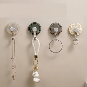 Set of 4 heavy-duty adhesive wall hooks with stylish radial pattern in various colors