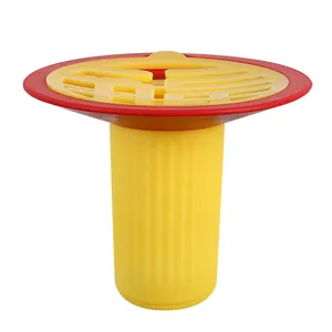 Yellow and red anti-odor floor drain core with decorative Fu character design
