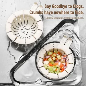 White cat-themed kitchen sink strainer with residue filtering shown in a stainless steel sink