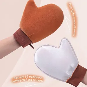 Tanning oil applicator mitt with plush surface and waterproof lining for body lotion.