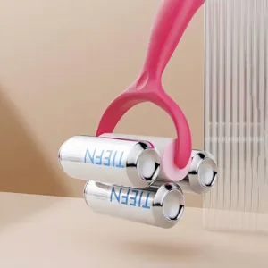 Standing pink lint roller with diagonal tear sheets demonstrating strong adhesive power