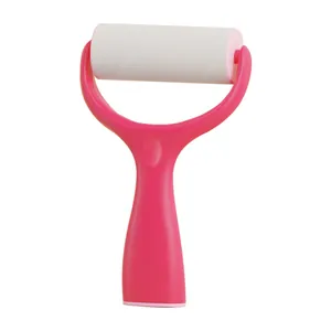 Ergonomic standing lint roller with pink handle for efficient clothes hair removal