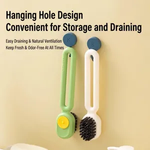 Multipurpose liquid-dispensing shoe brush with hanging hole design for storage