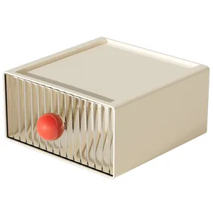 Cream stackable drawer storage box with red spherical handle and fluted front panel