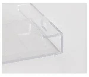 Macro view of transparent acrylic monitor memo board showing mounting slot and edge detail