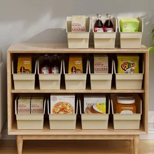 Cream plastic storage bin with slanted opening for cabinet organization
