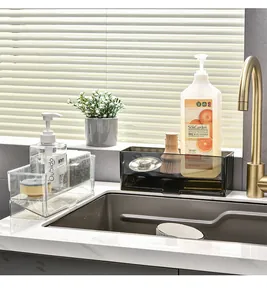 Modern transparent and tinted kitchen sink organizers holding dish soaps and sponges