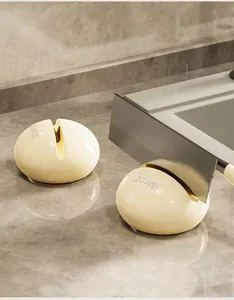 Close-up view of a cream-colored suction cup knife sharpener sharpening a steel blade