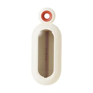 Spazzola levapeli statica portatile per vestiti con moderno design bianco arancio