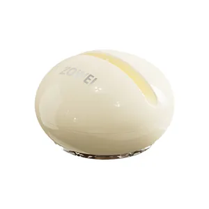Creamy white suction-cup knife sharpener with ZOWEI branding and tungsten steel slot