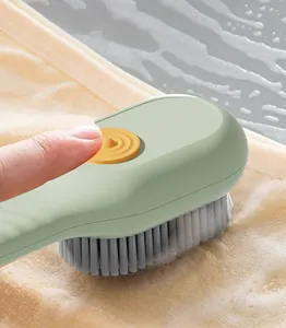 Detailed macro view of liquid dispensing shoe brush with soft bristles and cleaning foam