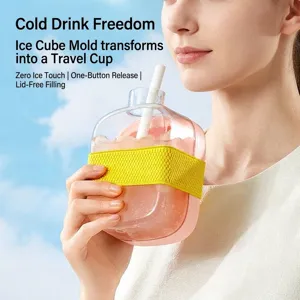 Portable pink silicone ice cube mold water bottle with straw and a yellow grip