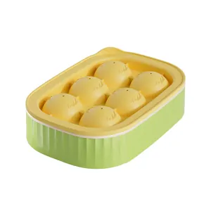 6-cavity silicone round ice ball mold with green container and yellow lid