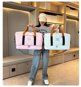 Large capacity travel duffel bag gym sports shoulder bag with shoe compartment and quilted design.
