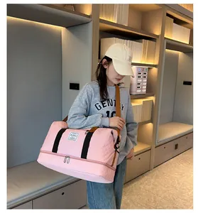 Large capacity pink gym duffel bag for travel, featuring waterproof quilted fabric.