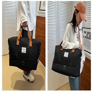 Large capacity travel duffel bag with bottom compartment and comfortable shoulder straps for gym sports.