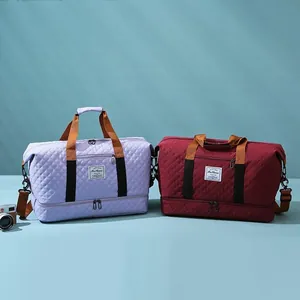 Large capacity travel duffel bag fitness sports gym bag with quilted design and shoulder strap.