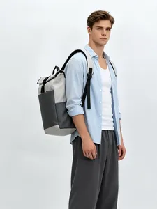 Model carrying minimalist sporty backpack in gray and black with large capacity