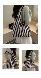 Model wearing a black and white striped tote bag with cute bow patterns for daily use