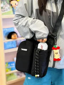 Detailed shot of an outdoor sports crossbody bag with a dedicated water bottle holder.