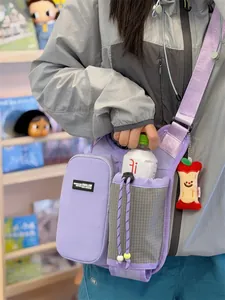 Multi-functional purple outdoor crossbody bag showing convenient water bottle holder detail