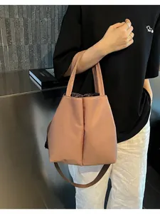 Close-up of a pink large insulated water bottle tote bag with shoulder strap