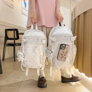 Zaino bianco a pois carino per ragazze con ciondoli di peluche e dettagli ad ala