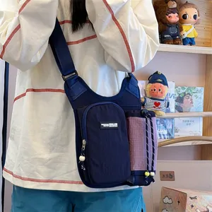 Close-up of lightweight outdoor water bottle crossbody bag with color-block design