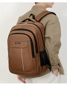 Back view detail of a brown large-capacity Oxford business backpack worn by a male model