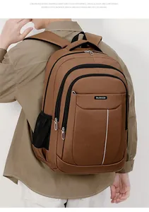 Detailed view of the large capacity brown Oxford backpack for men's business commute.