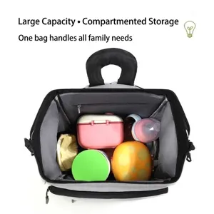 High-capacity diaper backpack showing organized interior with baby bottles and lunch boxes
