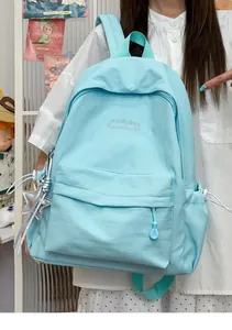 Zaino scolastico casual azzurro con dettaglio portachiavi a stella per studenti