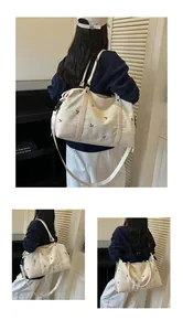 Woman carrying white expandable travel bag with cherry embroidery in life scene