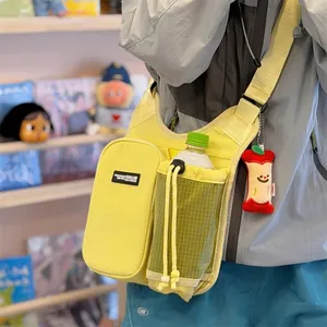 Detailed view of a yellow outdoor sports water bottle bag with a drawstring bottle holder