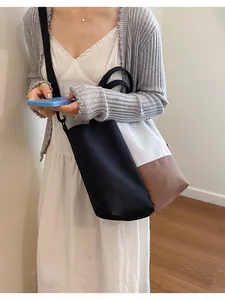Large color-block water bottle bag with crossbody strap for daily commuting