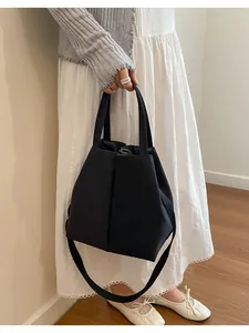 Versatile black large water bottle carrier bag with shoulder strap for daily commuting