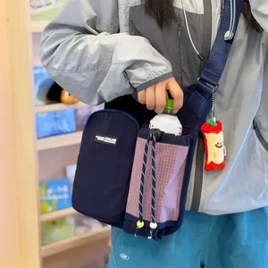 Lightweight outdoor crossbody bag with water bottle holder in navy blue and pink plaid