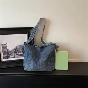 Vintage blue denim crossbody messenger bag for women in minimalist retro fashion style
