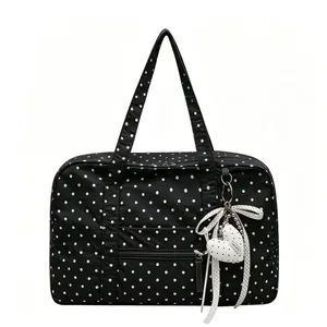 Stylish black and white polka dot lightweight tote bag with heart shaped ribbon charm