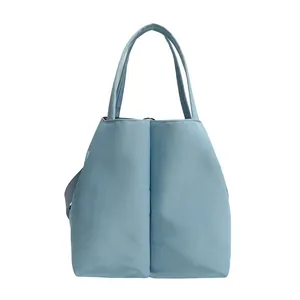 Large light blue commuter tote bag with double cup slots and adjustable crossbody strap