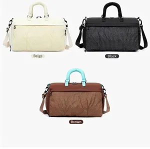 Multi-functional large capacity travel duffel bags in beige, black, and brown colors.