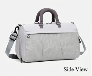 Close-up side view of a large light gray travel bag with grid texture