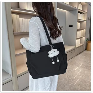 Large capacity black commuter tote bag for women with a cute white cloud pendant