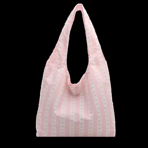 Pink and white striped tote bag with cute bow pattern for daily commuting