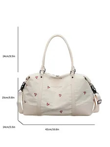 Large cream travel bag with red floral embroidery showing dimensions 42x25x14 cm and handle drop