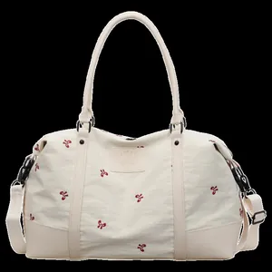 Cream white travel bag with red bow pattern and large capacity duffel
