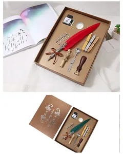 Set regalo penna piuma vintage e sigillo di cera con inchiostro e pennini in una scatola